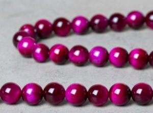 perle ronde oeil de tigre fuchsia 8mm pierres naturelles pierres fines